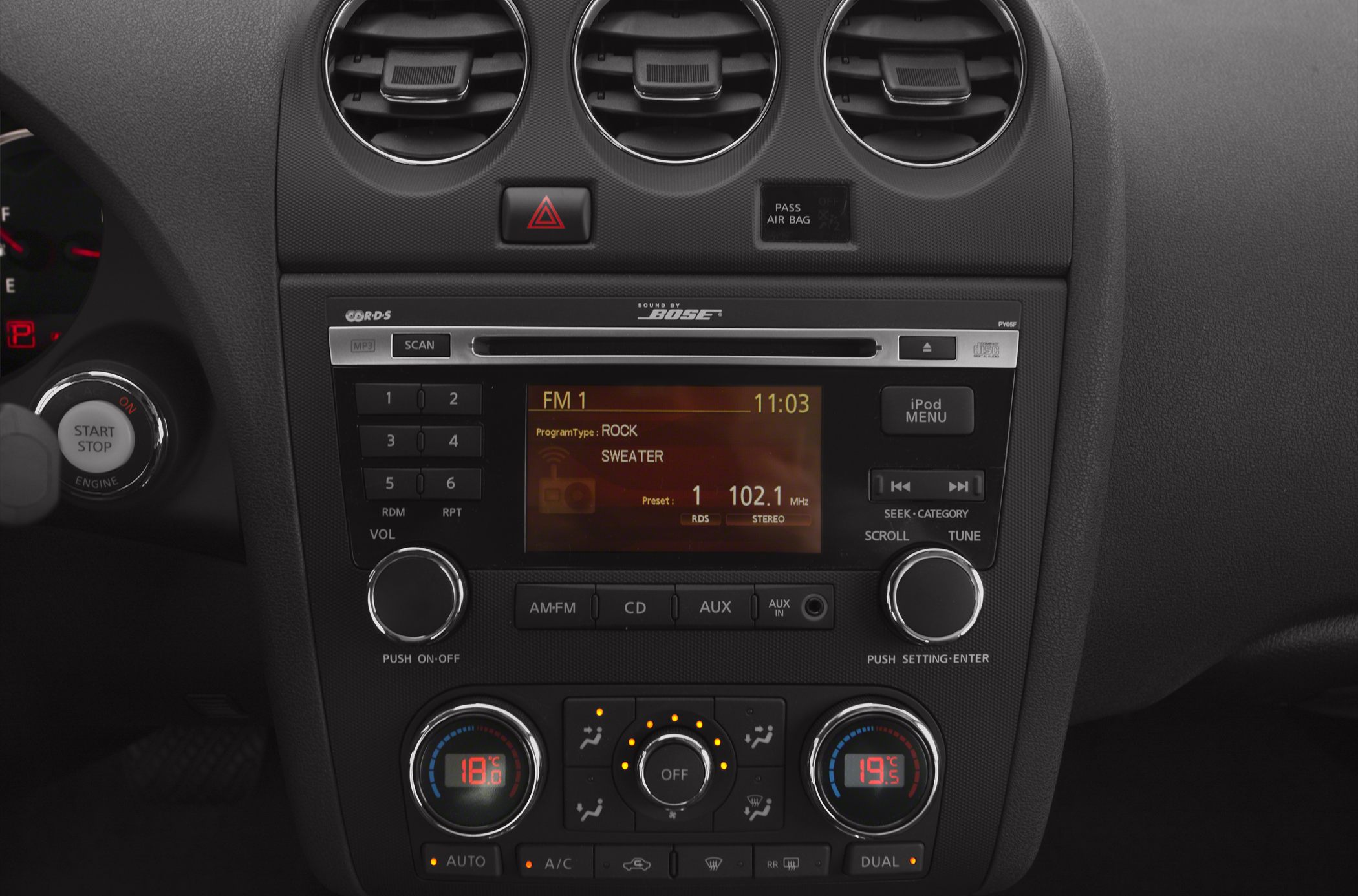 Car center console with audio system and dual-zone climate controls