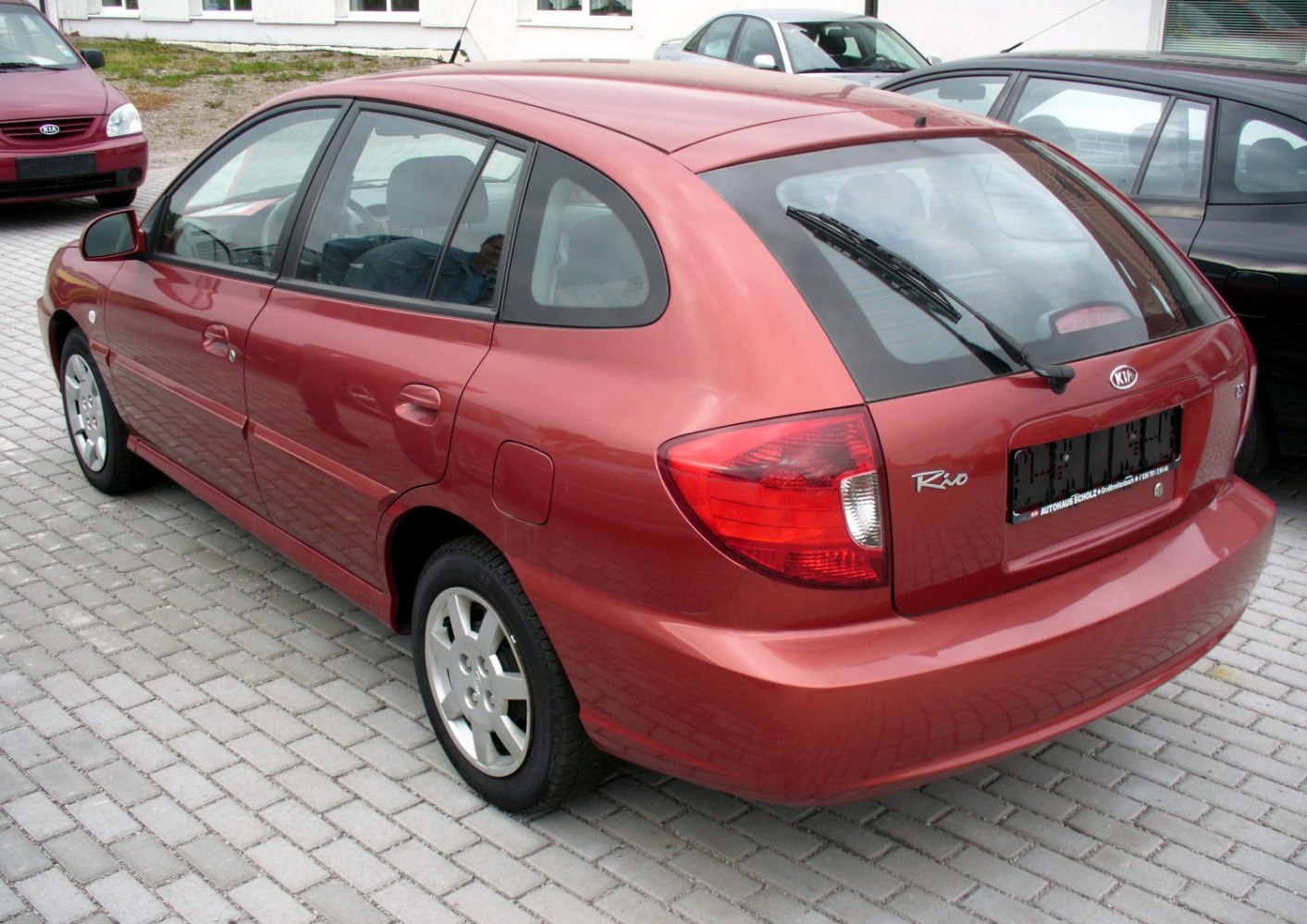 Rear view of a compact hatchback with rear window wiper and distinctive taillights
