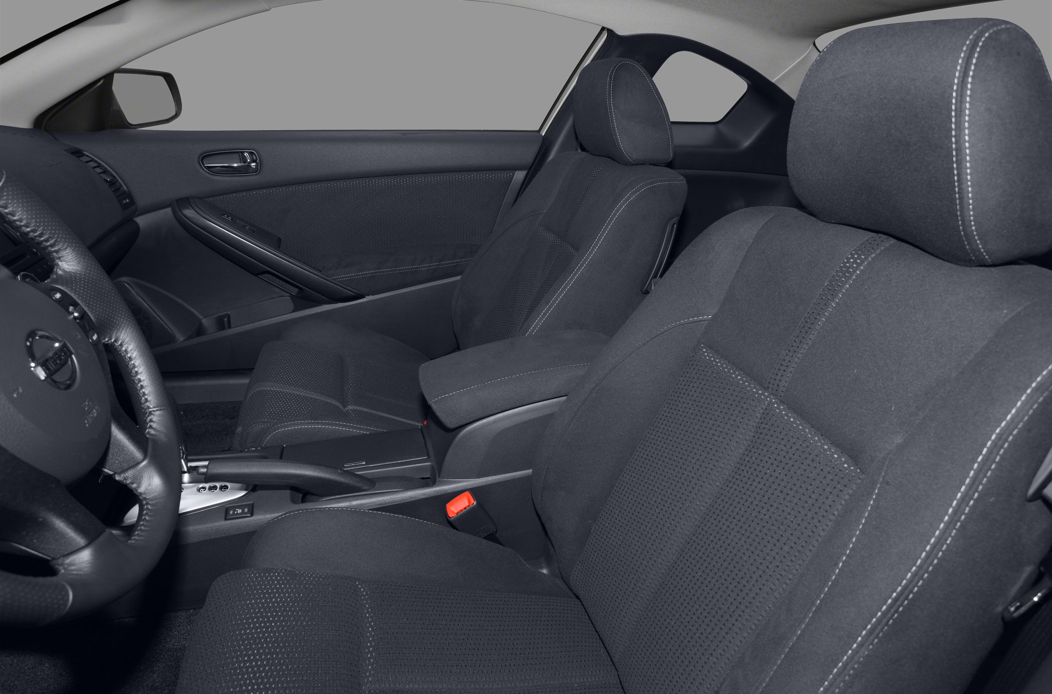 Front seats and door panel materials in a coupe interior