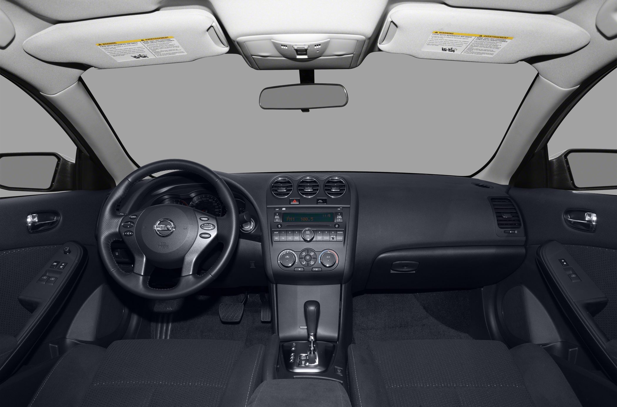 Dashboard, steering wheel, and center console layout in car interior