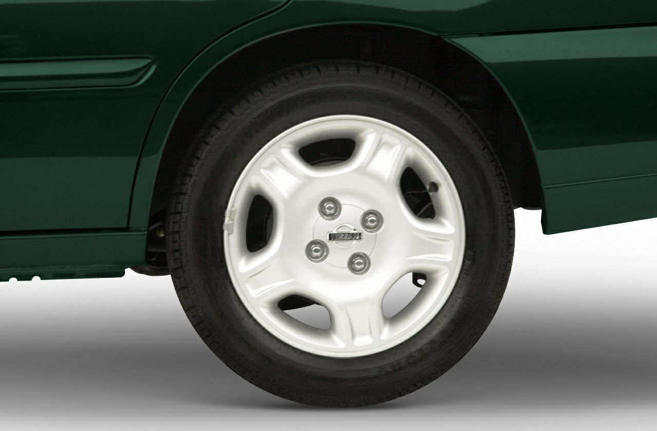 Close-up of a steel wheel with distinct five-lug nut design