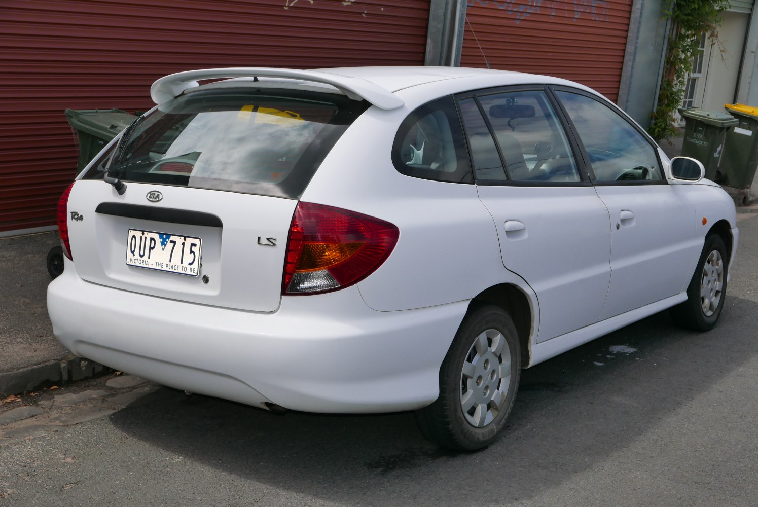 Rear view of hatchback with spoiler and distinctive tail lights