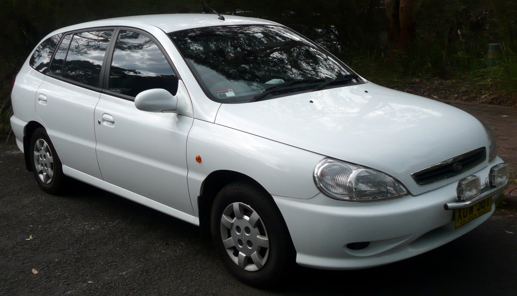 Compact hatchback front side view with distinct headlights