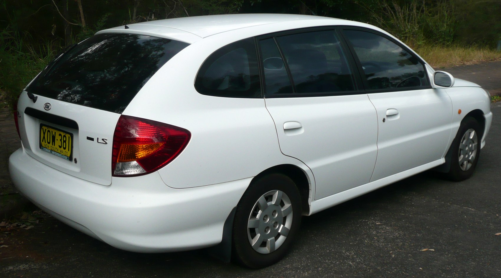 Rear and side view of compact hatchback with distinctive tail light cluster