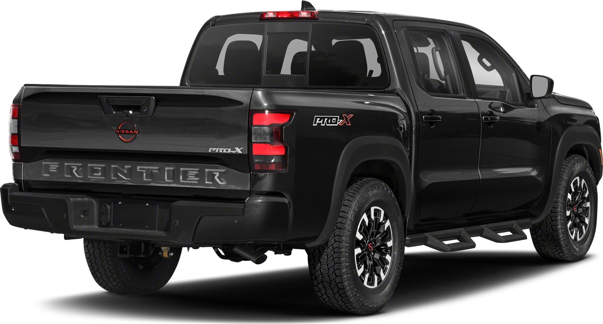 Rear view of a black pickup with PRO-X badge and rugged tires