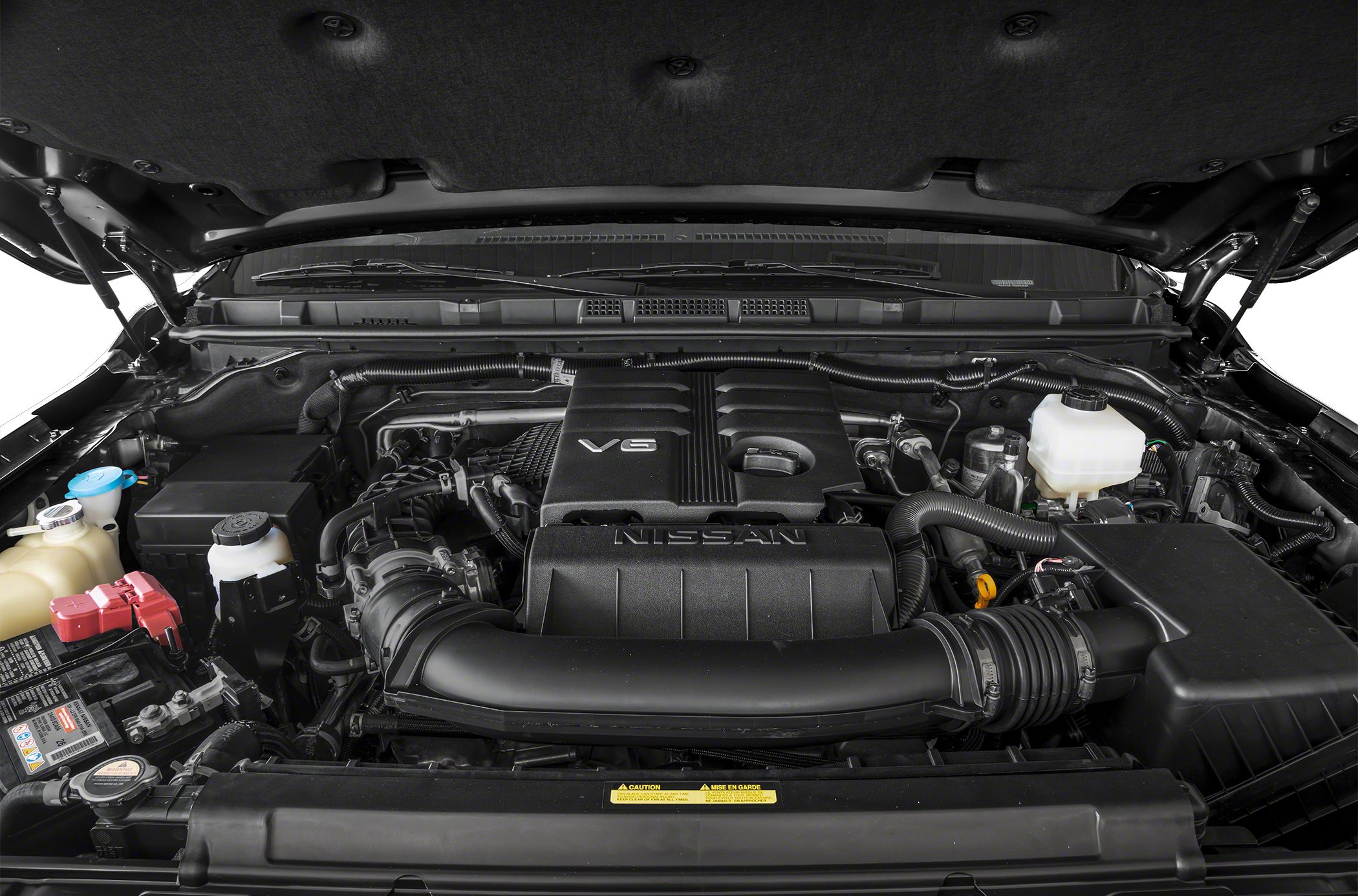 V6 engine bay with air intake and battery in a pickup truck