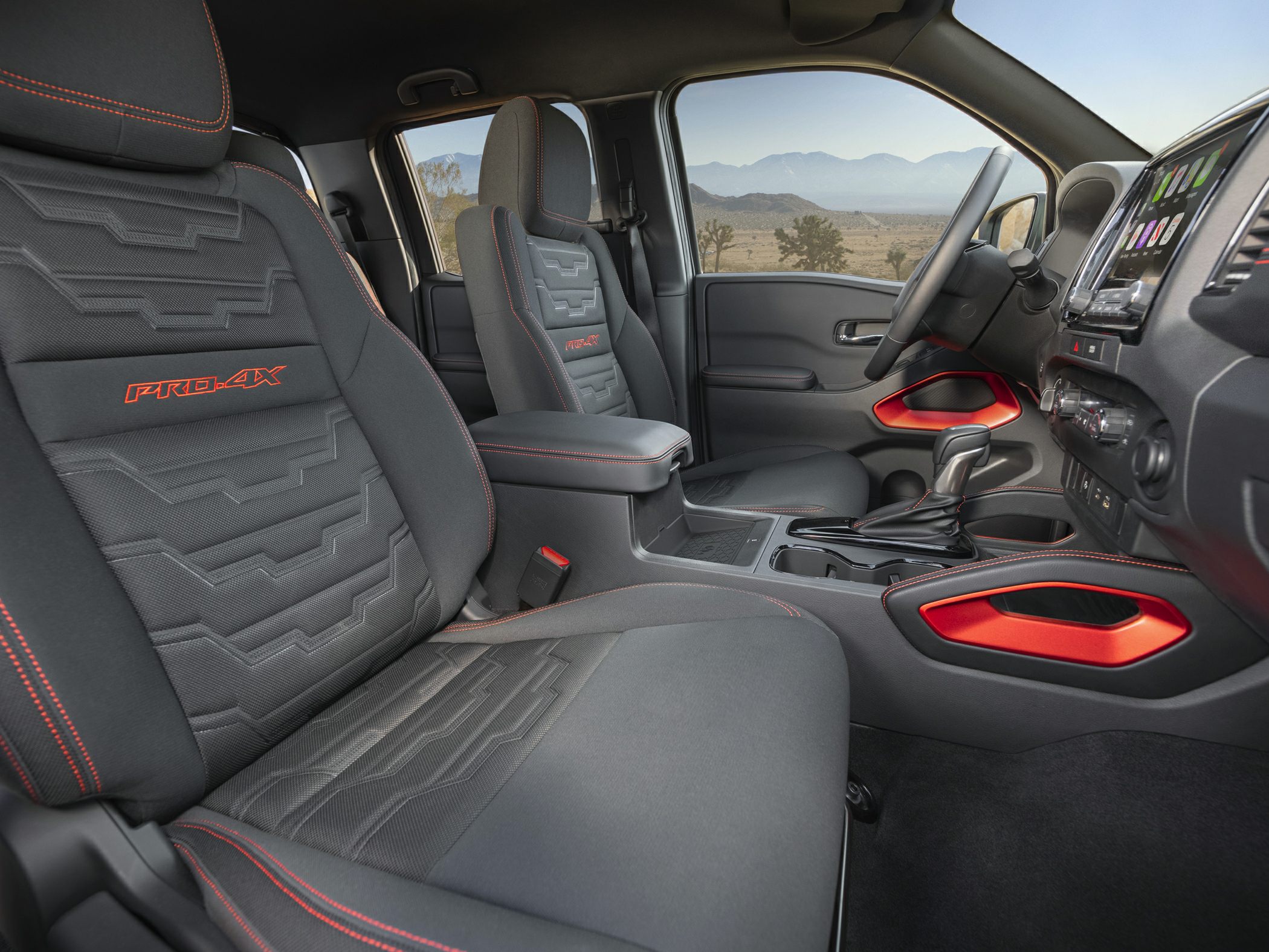 PRO-4X front seats with red stitching and modern dashboard design
