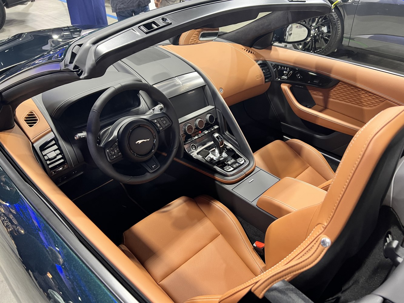 Premium tan leather sports car interior with modern dashboard layout