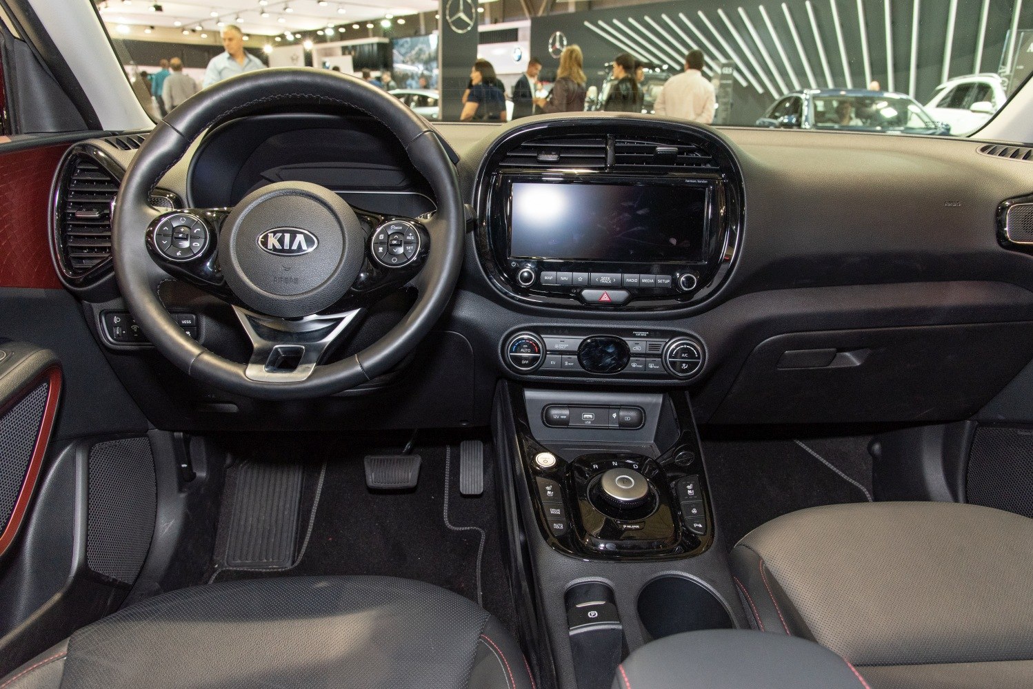 Dashboard interior with rotary gear selector and steering wheel controls