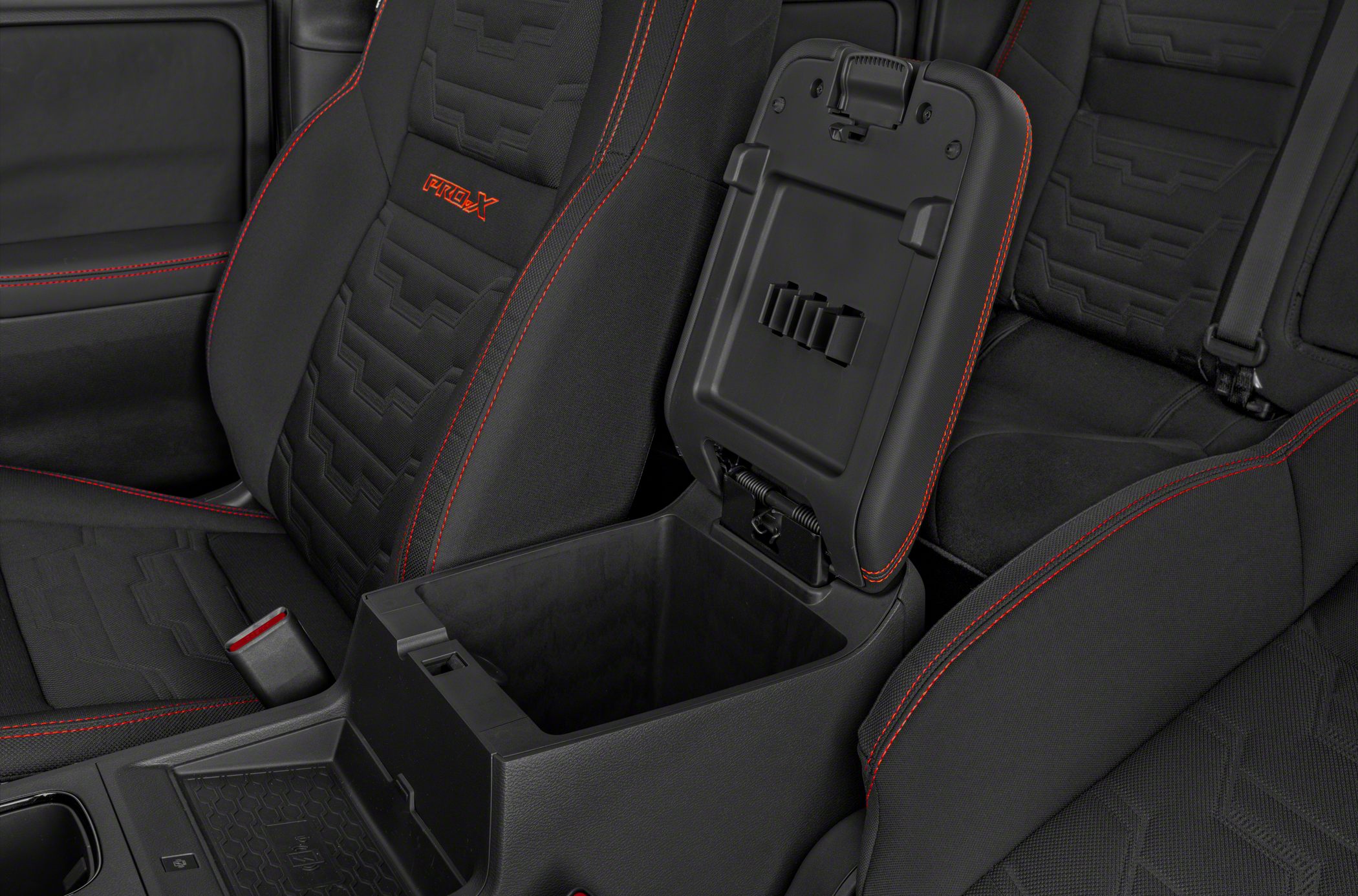 Black seats with red stitching and open center console storage