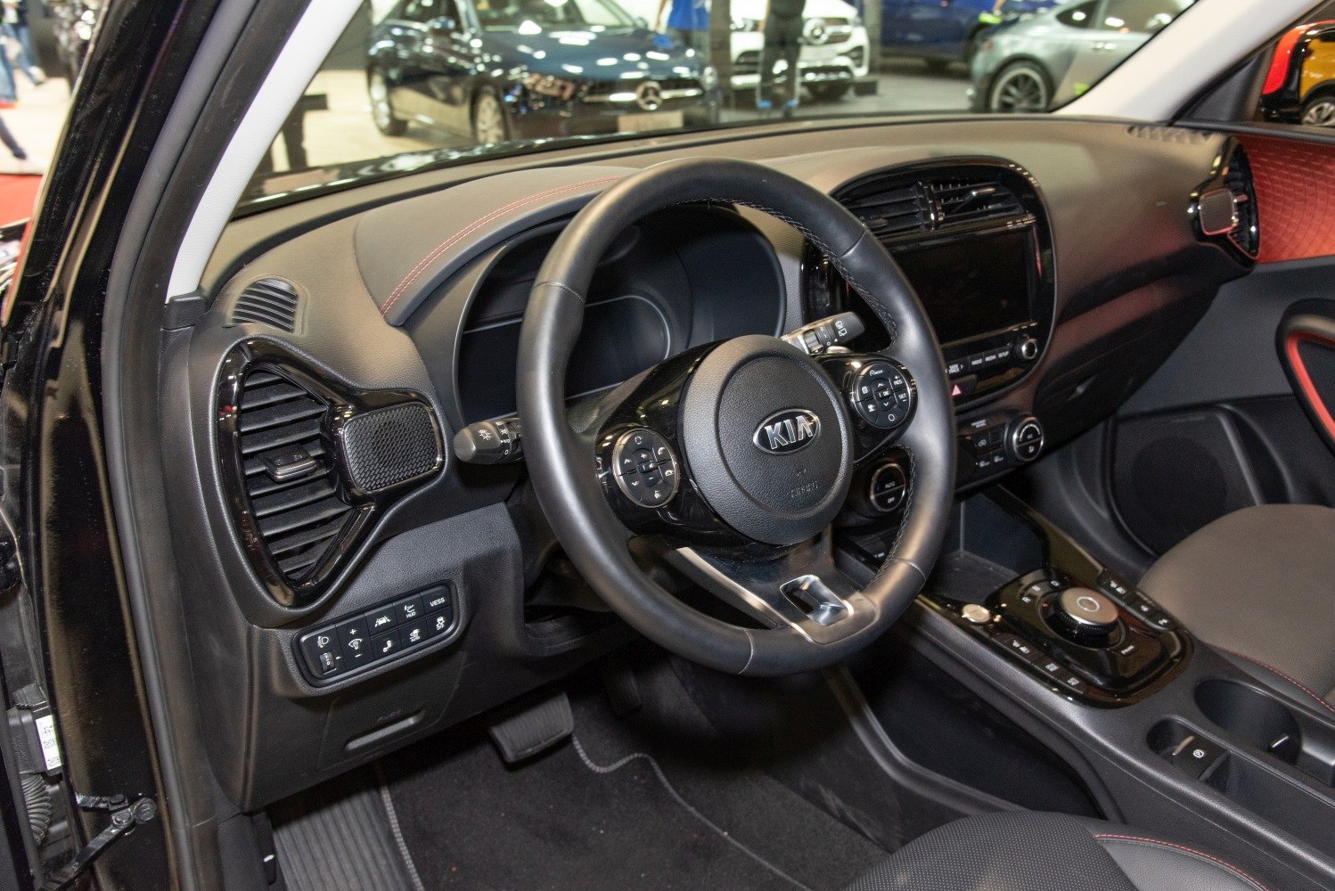 Steering wheel, dashboard, infotainment system, and control panel