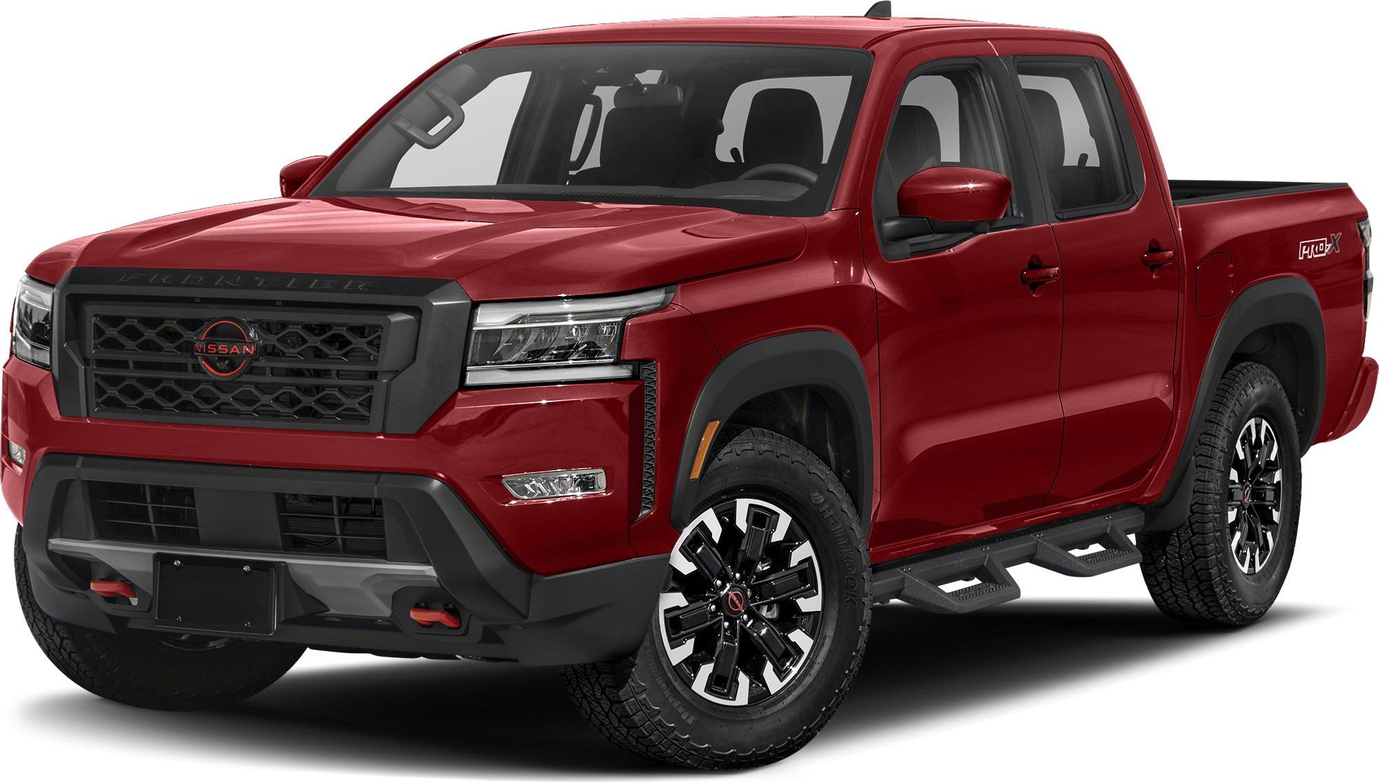 Front-side view of red pickup with bold grille and LED headlights
