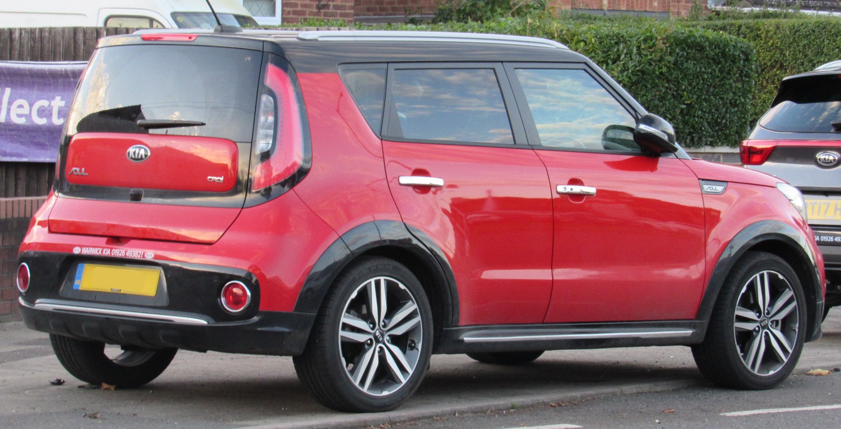 Rear and side profile with alloy wheels and two-tone trim