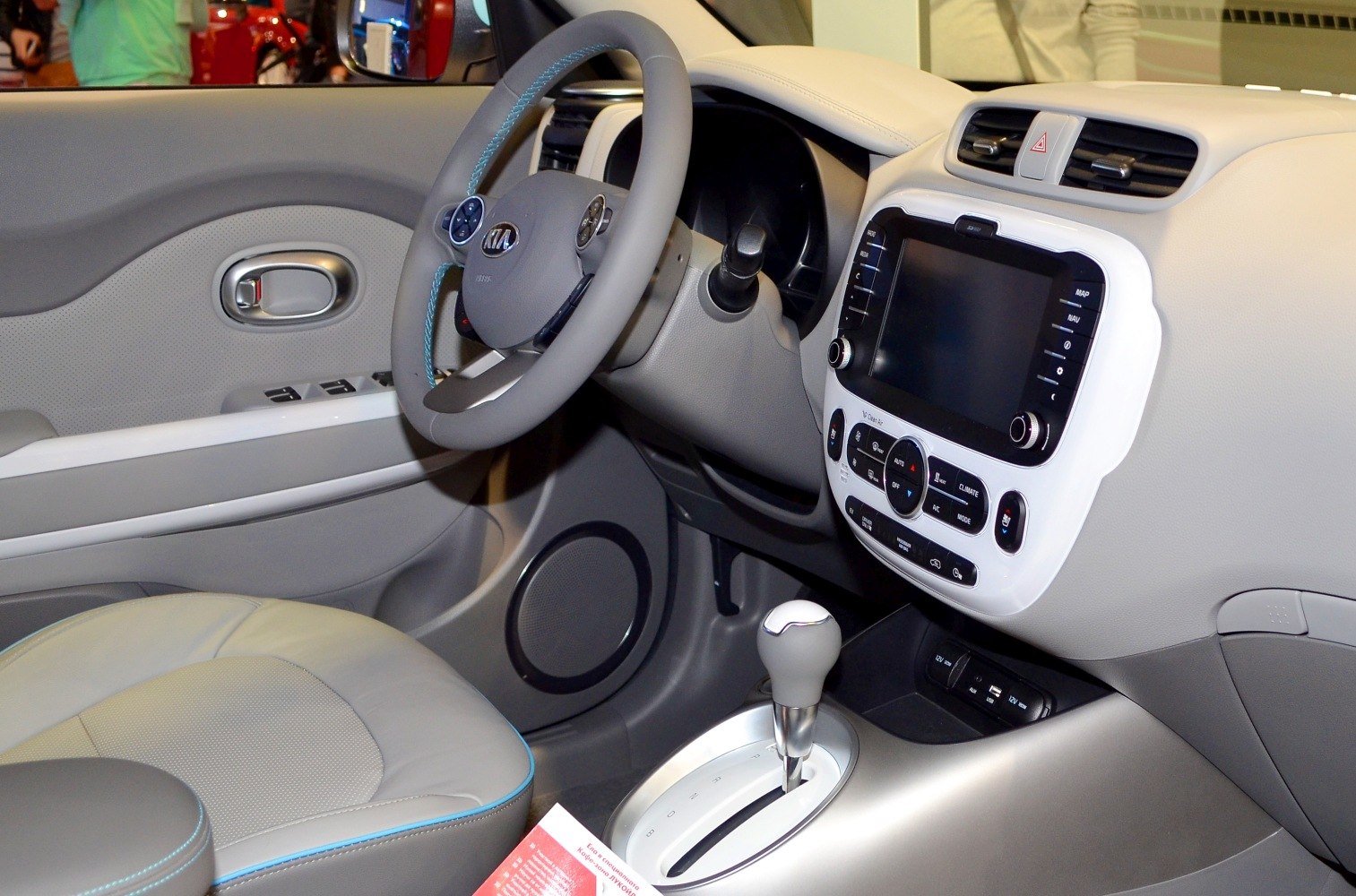 Steering wheel, touchscreen display, gear shift in car interior