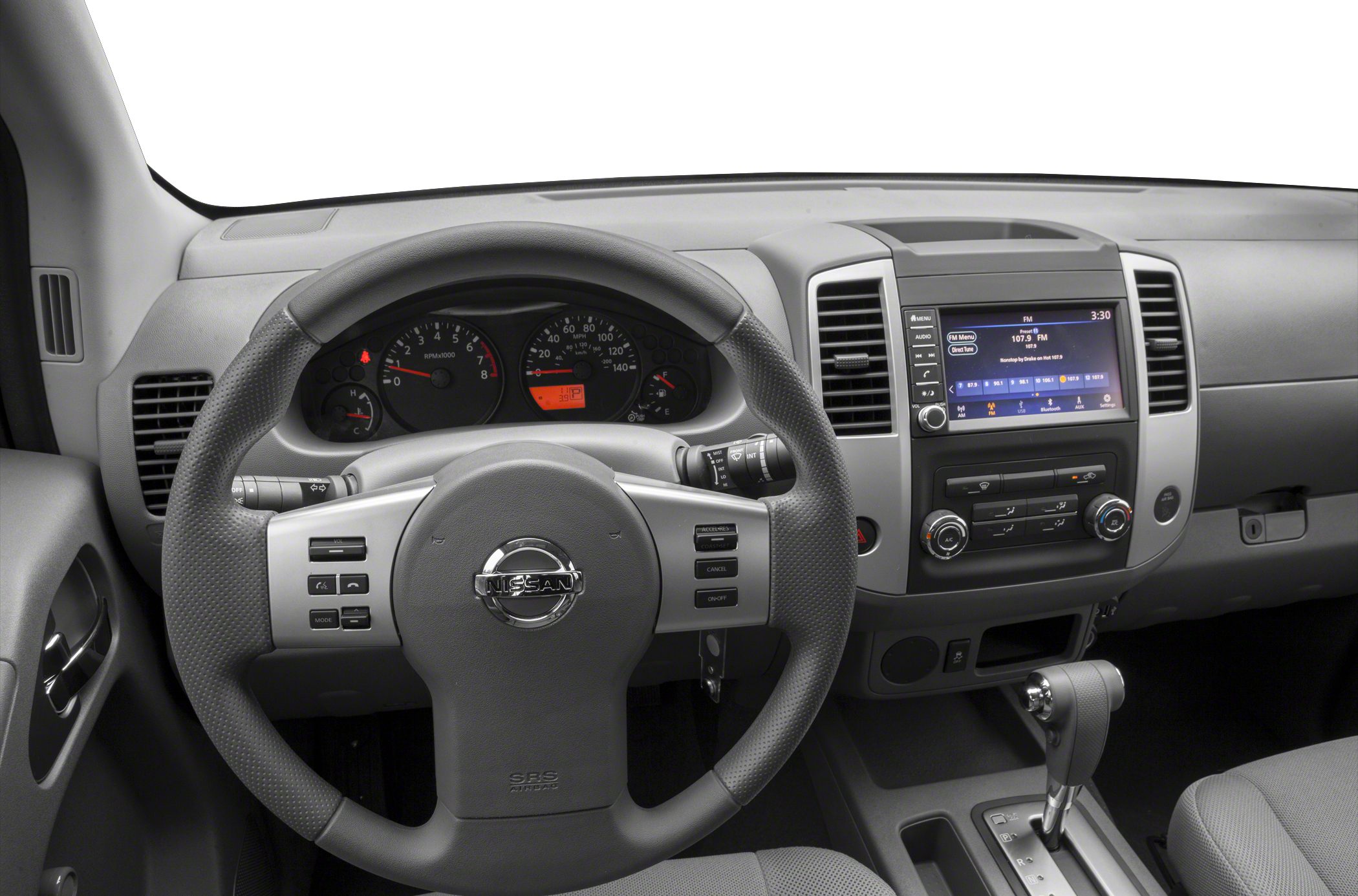 Steering wheel with controls, dashboard with instrument cluster and infotainment screen