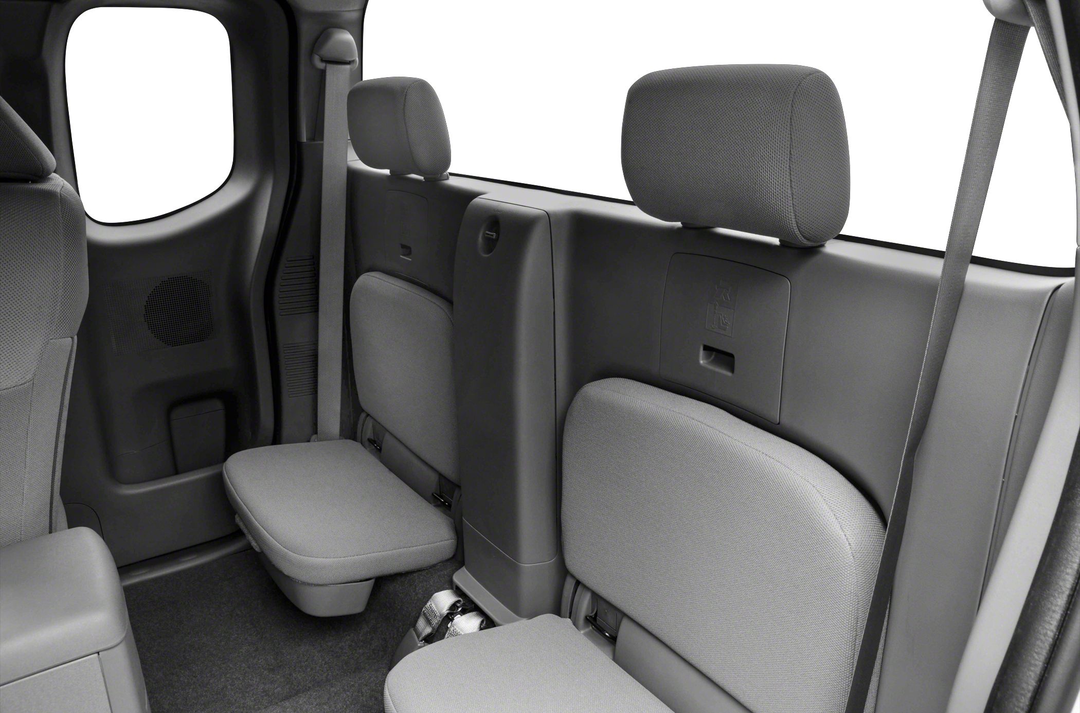 Rear foldable jump seats with headrests and seat belts.