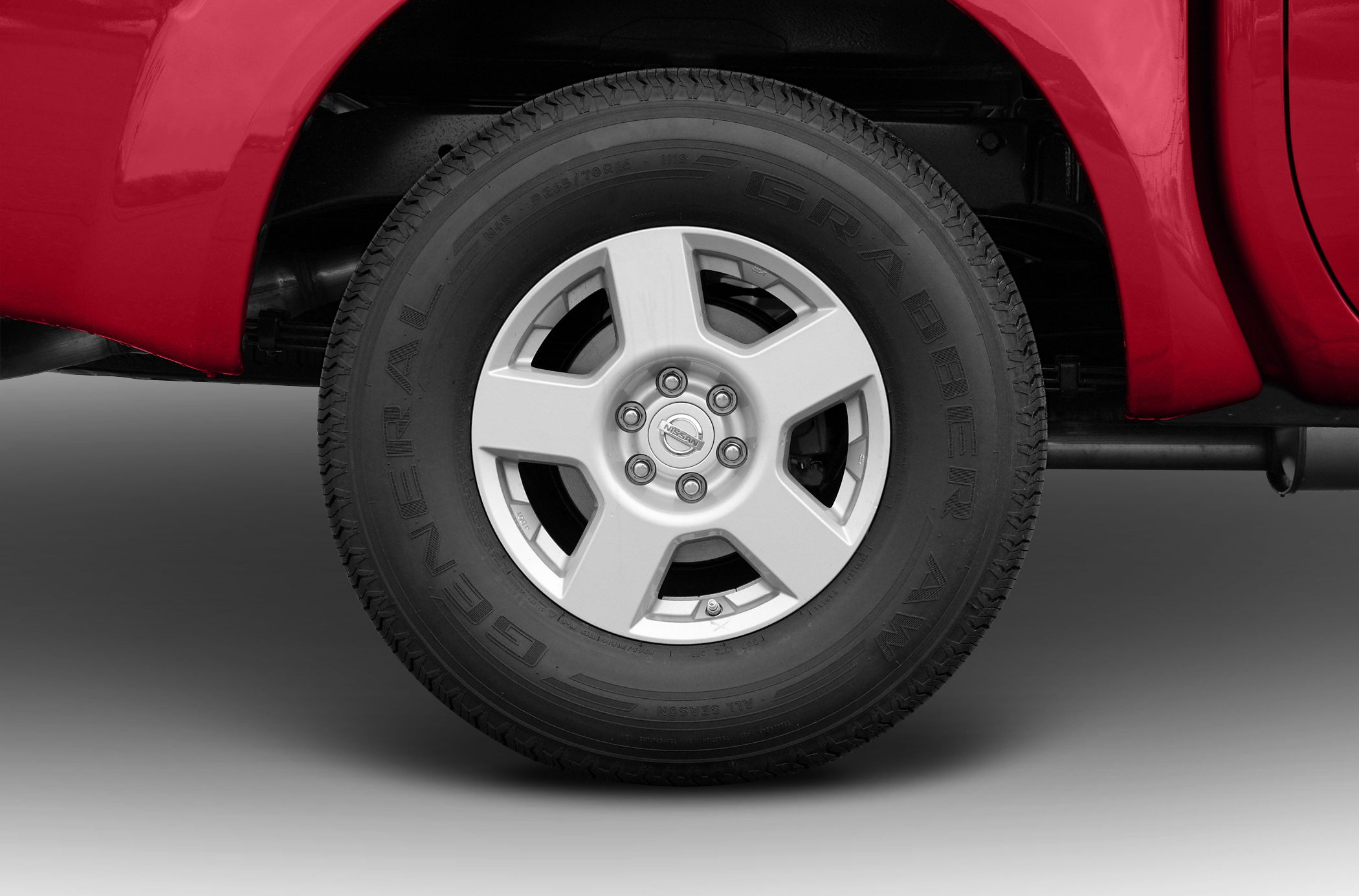 Alloy wheel with General Grabber AW tire on pickup truck