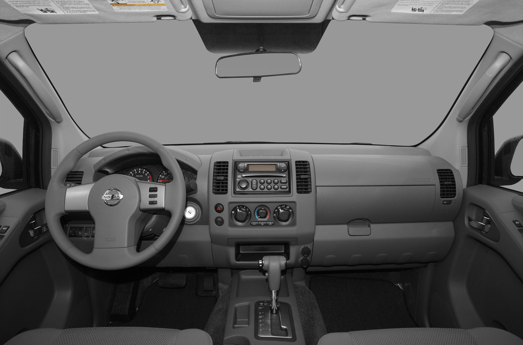 Dashboard and steering wheel of a pickup truck interior.