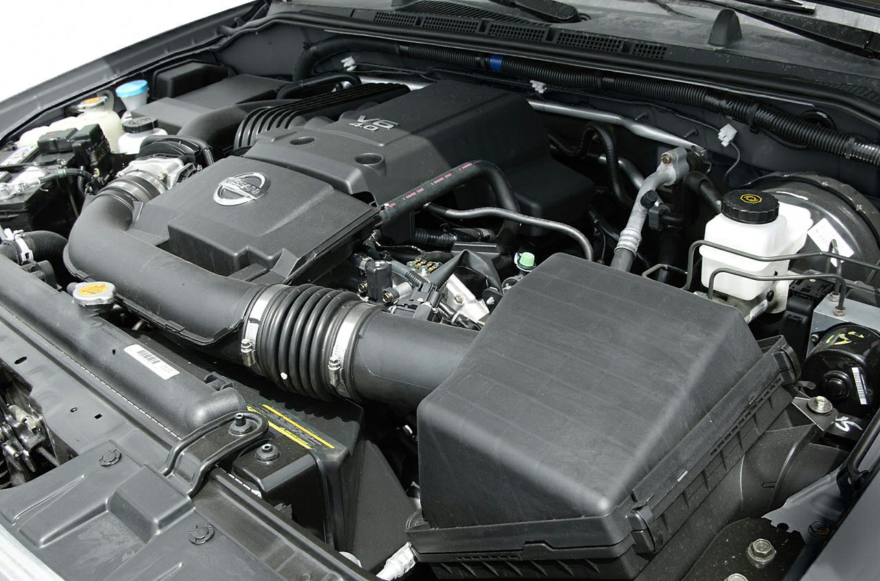 V6 engine bay with visible air intake and engine cover