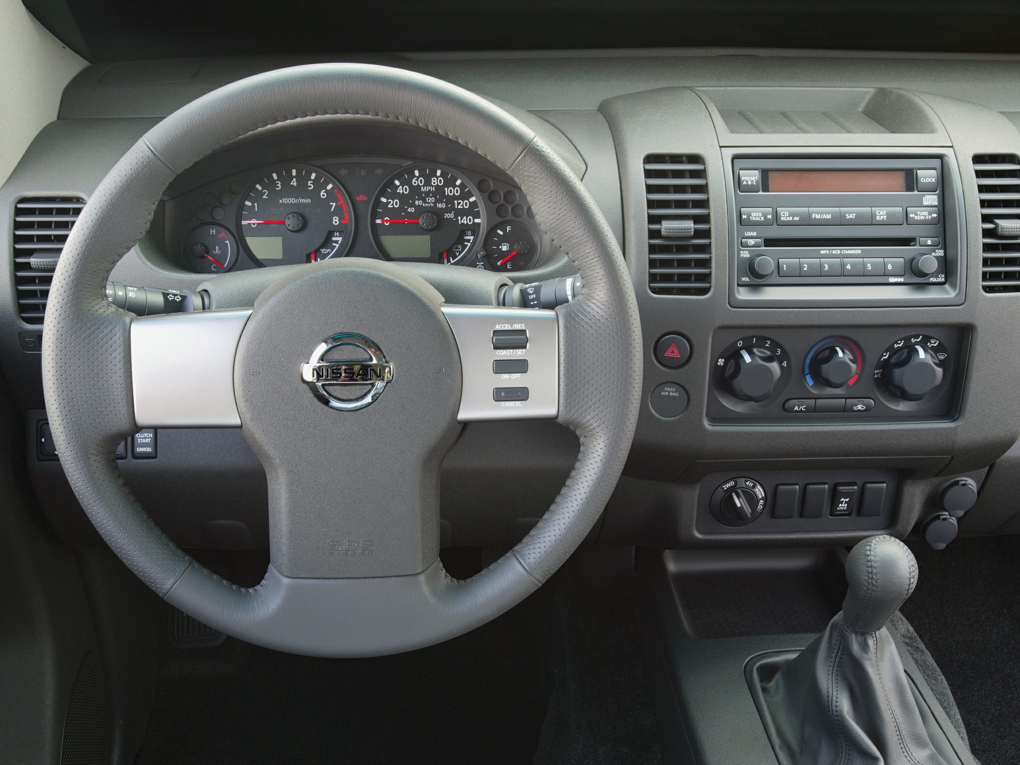 Steering wheel, instrument cluster, dashboard controls, manual gear shift