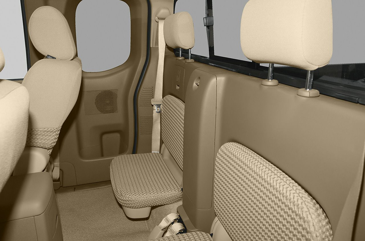 Beige rear interior with fold-down jump seats in extended cab