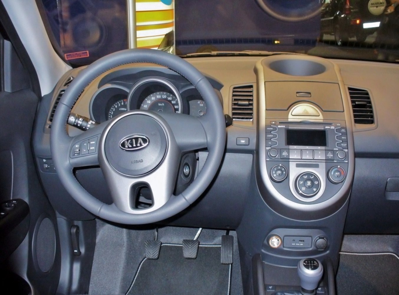 Dashboard, steering wheel, manual transmission pedals and center control panel