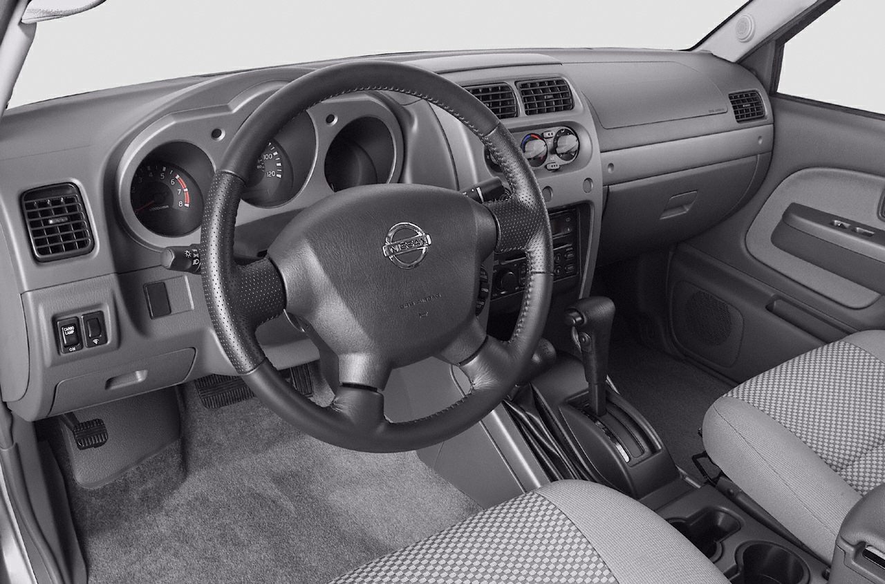 Dashboard and steering wheel with gear shift in truck interior