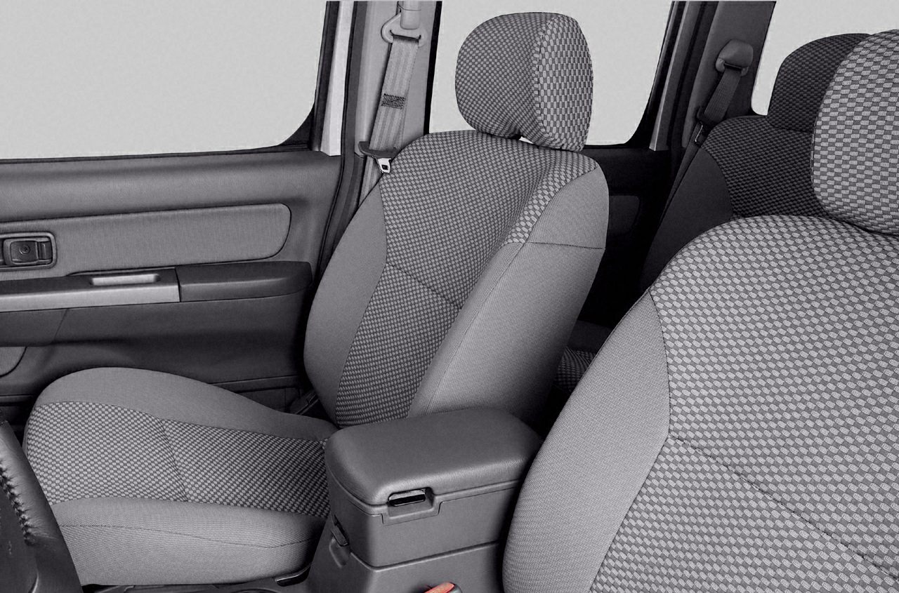 Front and rear fabric seats with center armrest in vehicle interior
