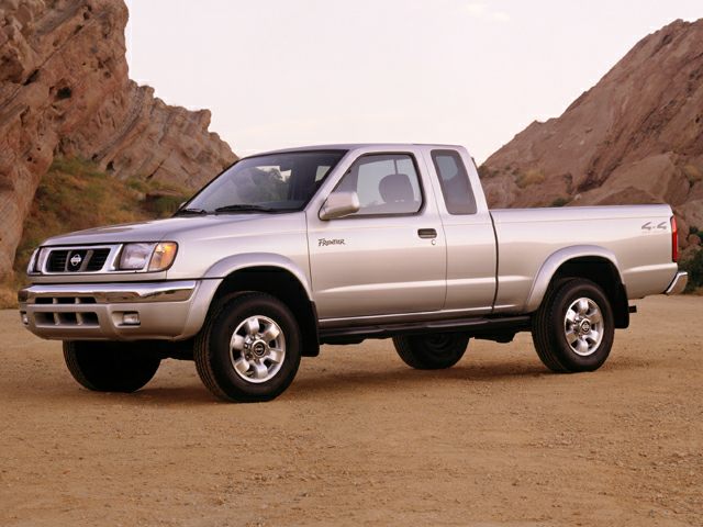 Silver extended cab pickup truck with rugged design and 4x4 markings