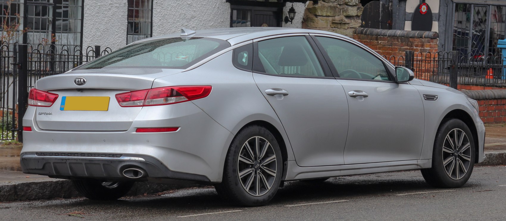 Silver sedan rear side view with modern taillights and alloy wheels