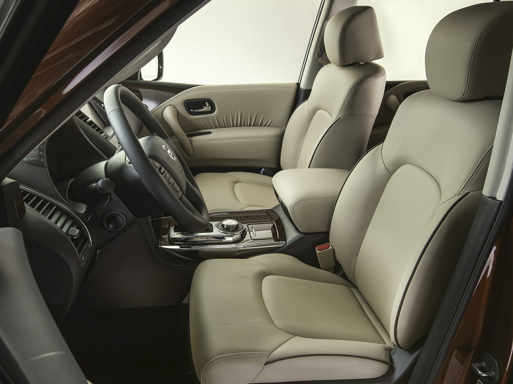 Beige leather front seats and center console interior