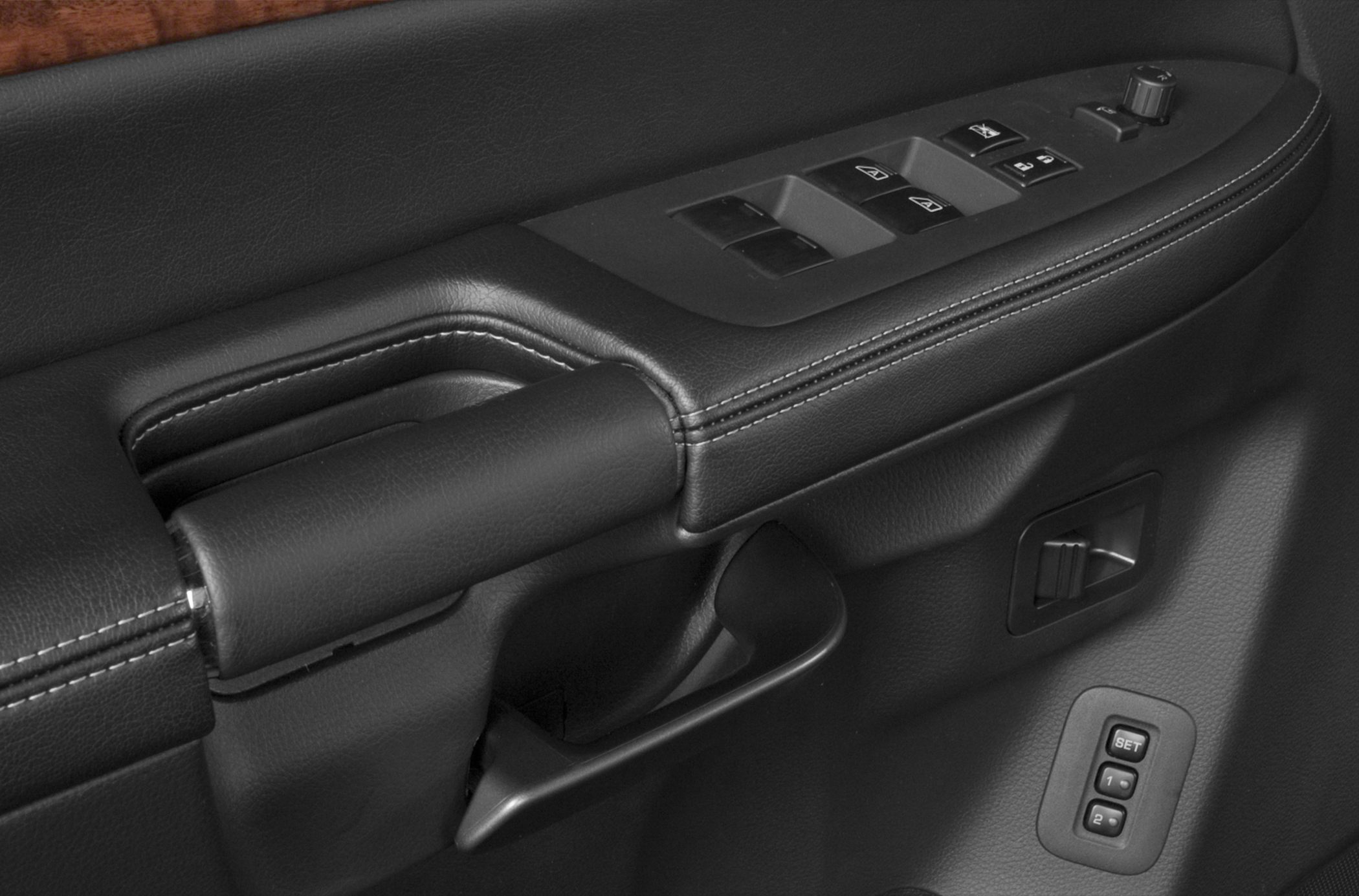 Power window and seat memory controls on vehicle door armrest