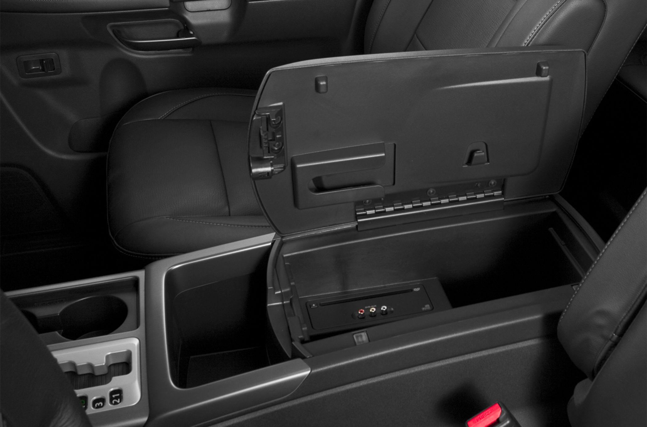 Open center console storage with media input ports in vehicle interior