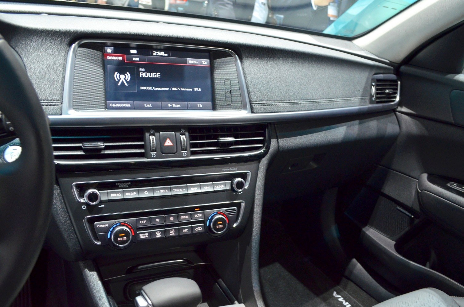 Dashboard with media display and climate controls