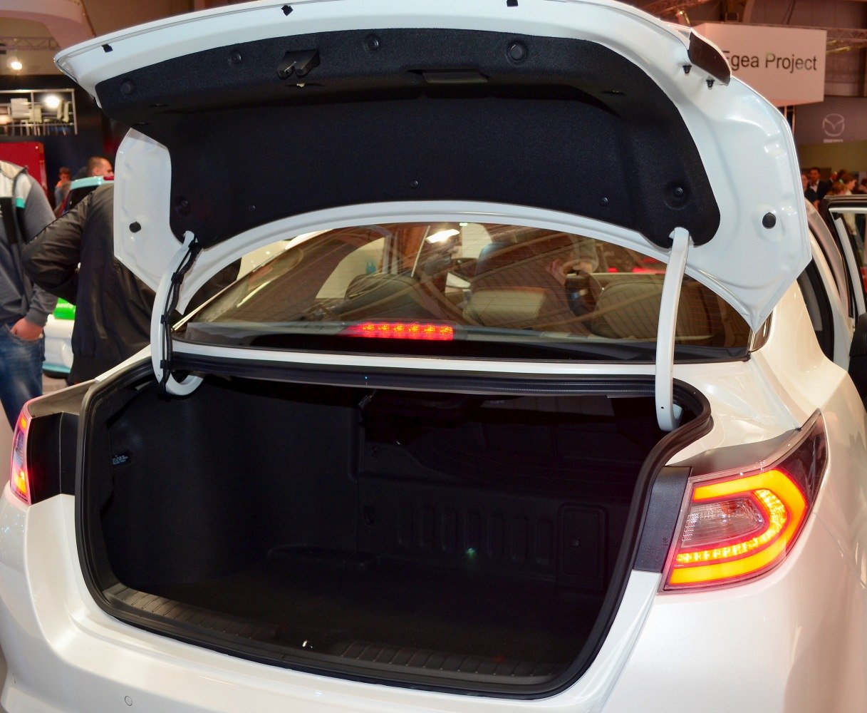 Open rear trunk interior with visible trunk lining and tail light