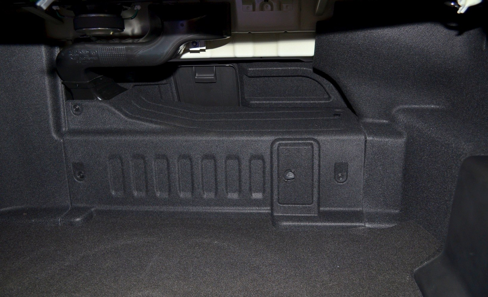 Trunk interior with compartments and molded lining