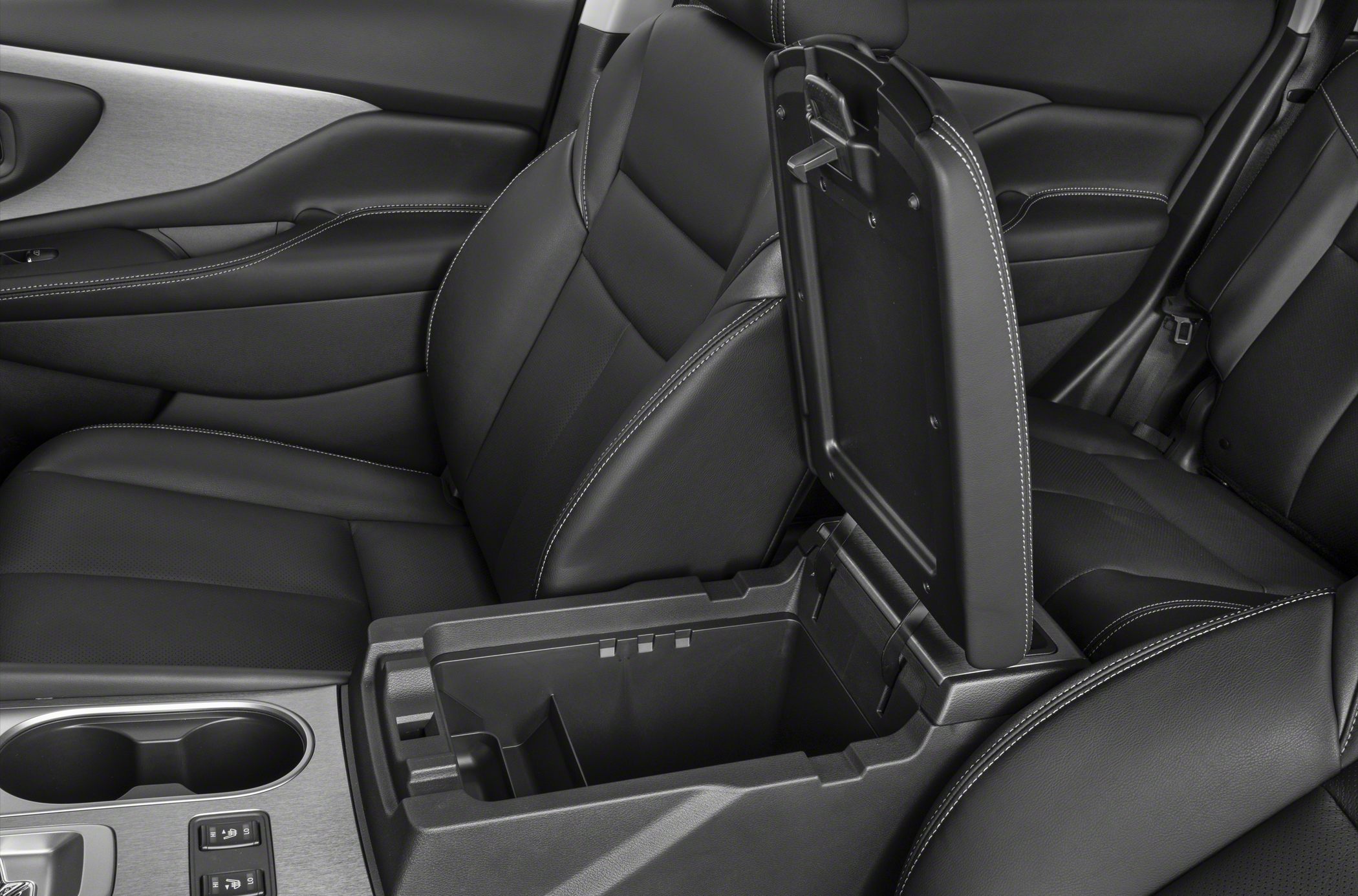 Leather seats with detailed stitching and open center console storage