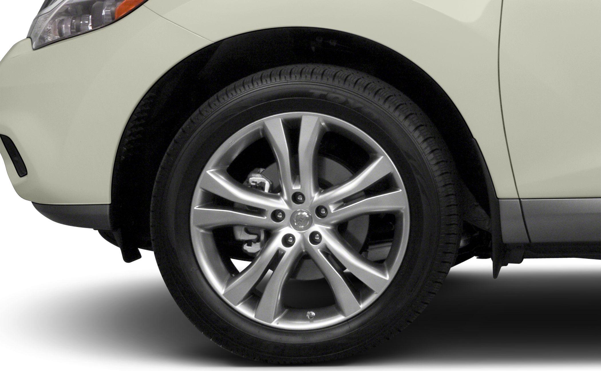 Front multi-spoke alloy wheel and tire with visible brake caliper
