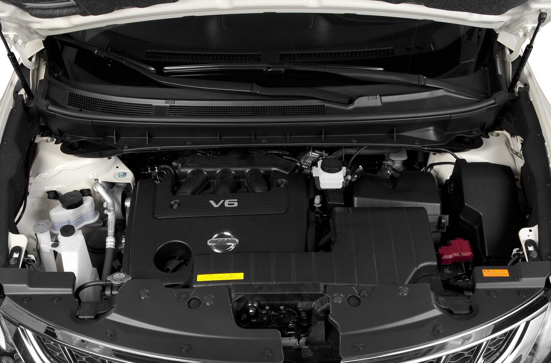 V6 engine bay with Nissan emblem and engine components