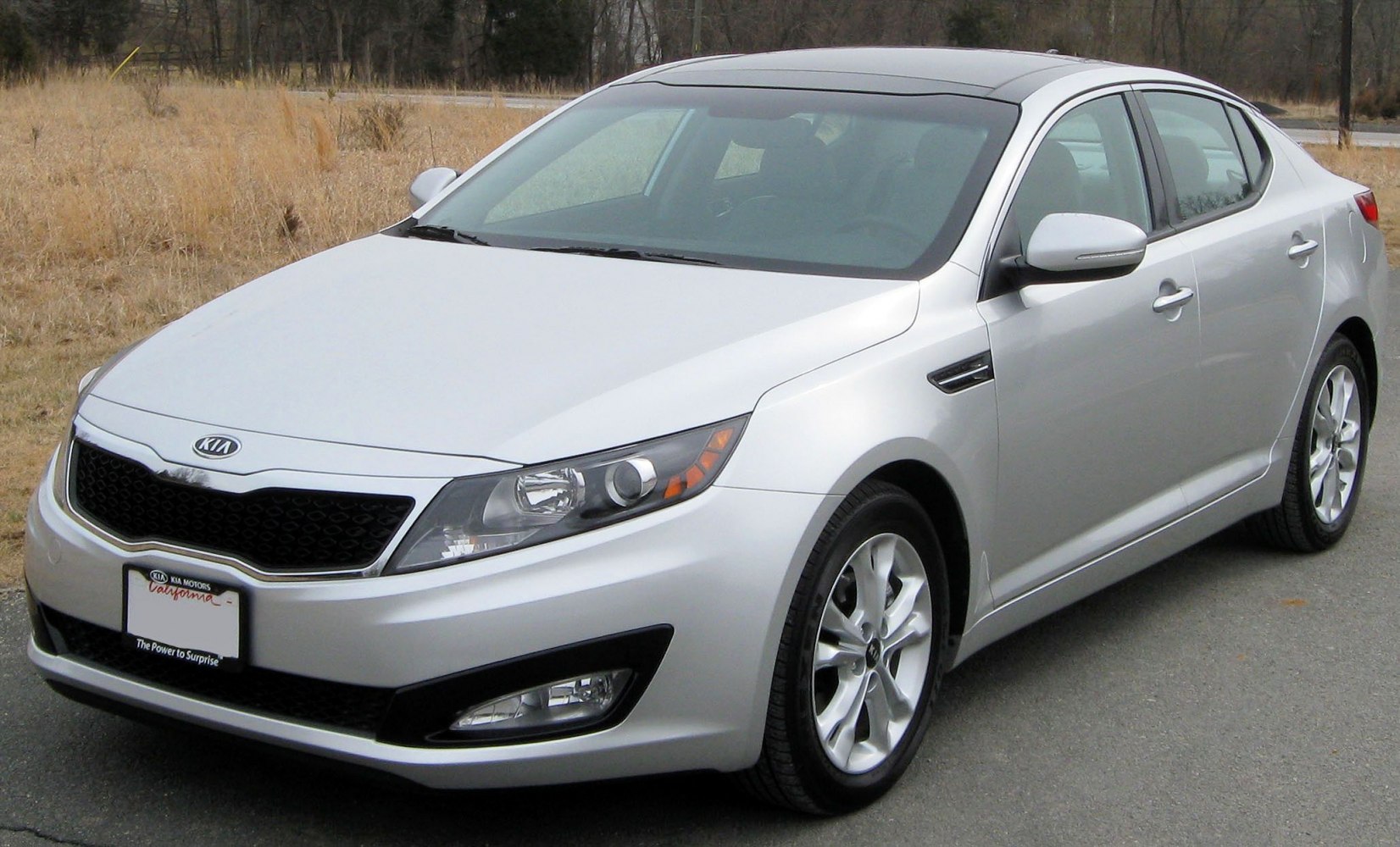 Silver sedan with prominent front grille and headlights