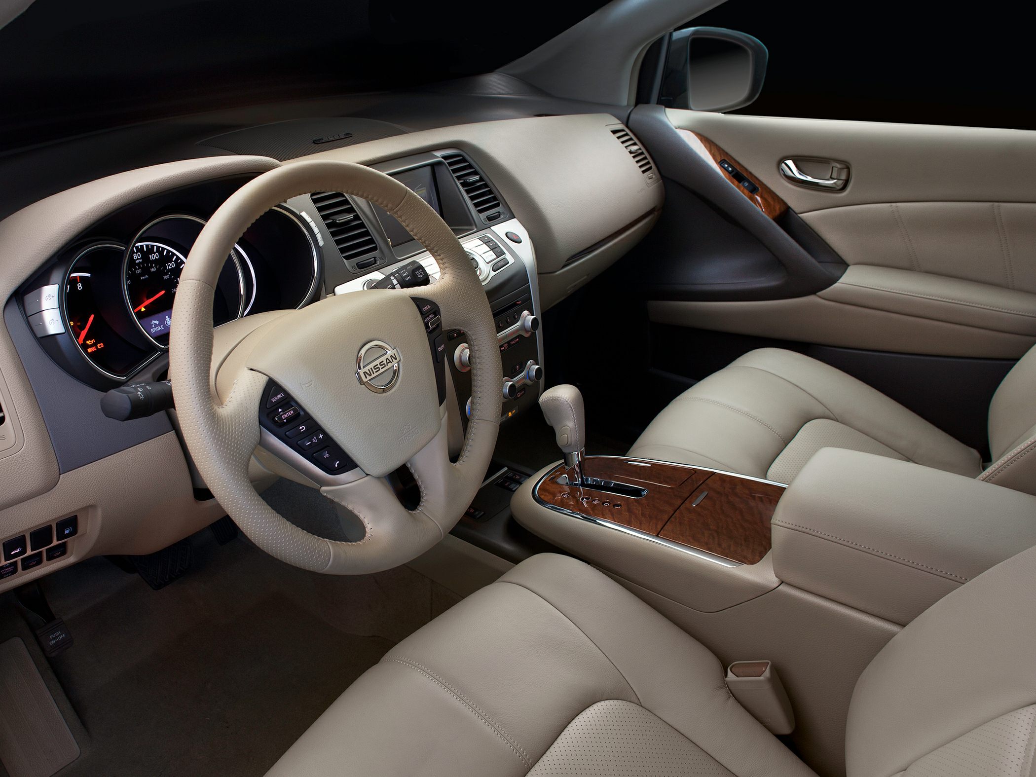 Beige leather interior with wood trim and leather steering wheel