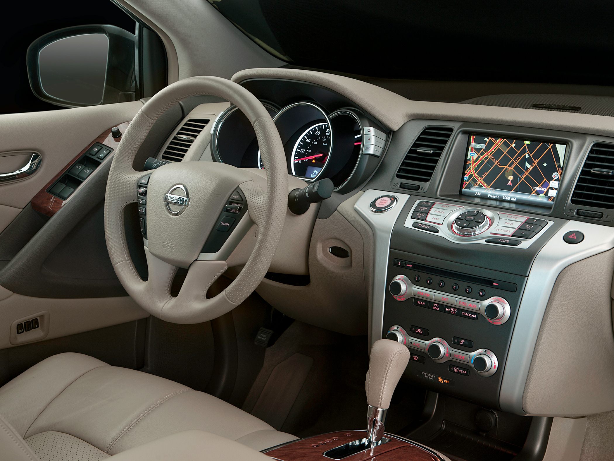 Leather steering wheel, dashboard with navigation and climate controls