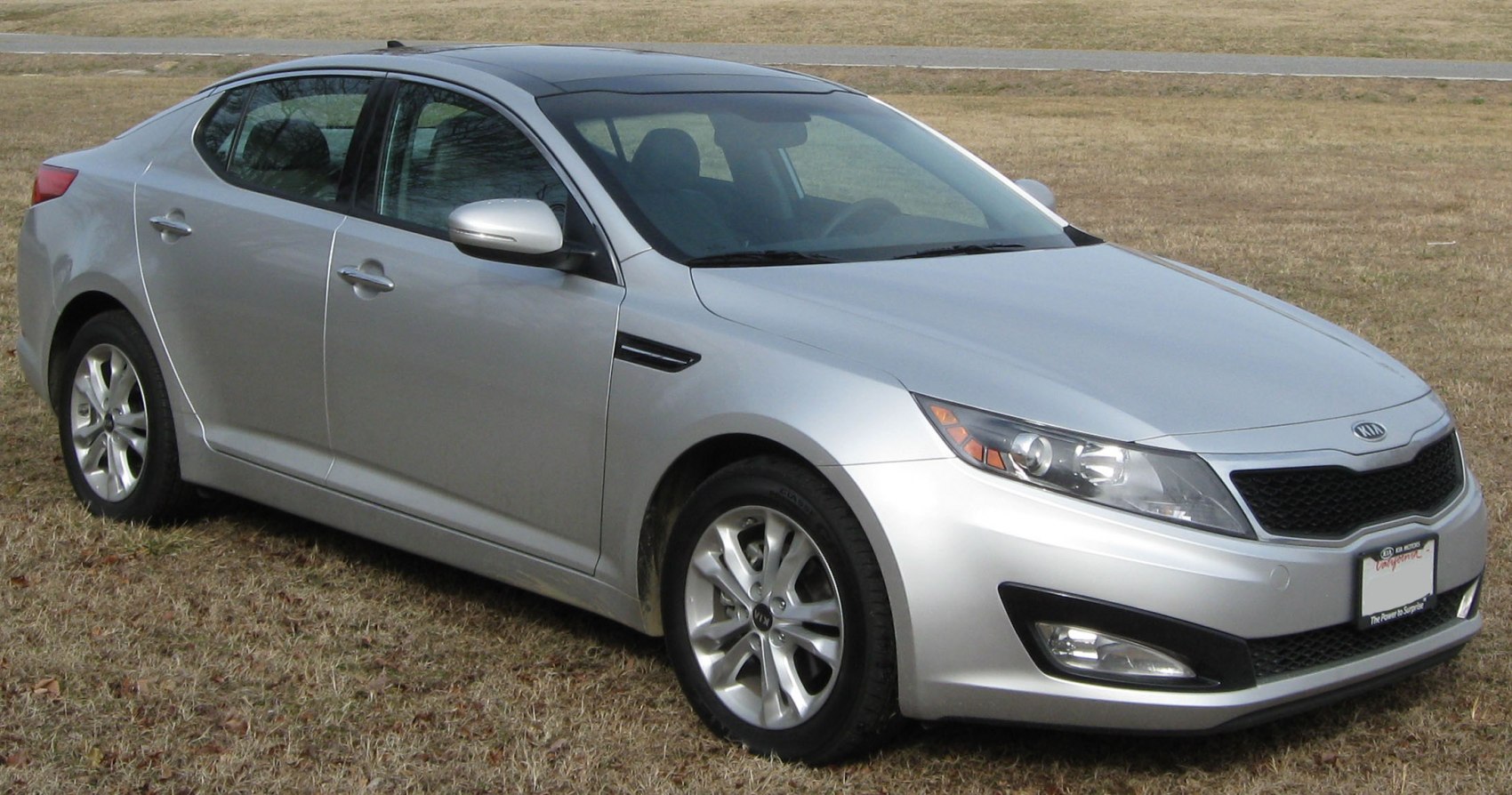 Silver mid-size sedan with panoramic sunroof and alloy wheels