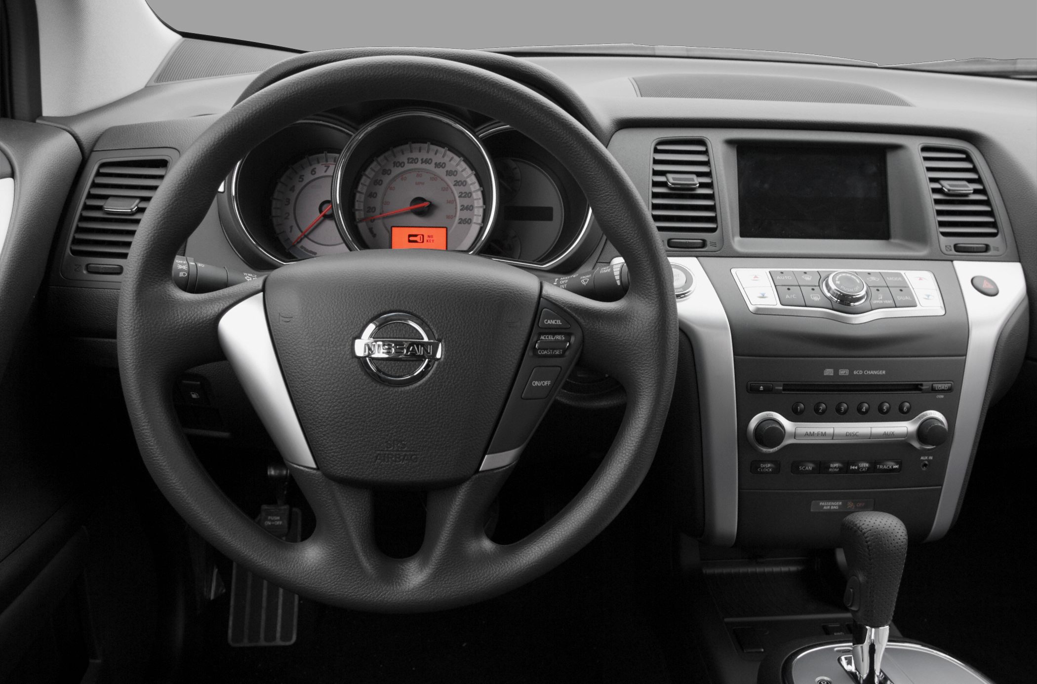 Steering wheel, instrument cluster, and central control panel of a vehicle interior
