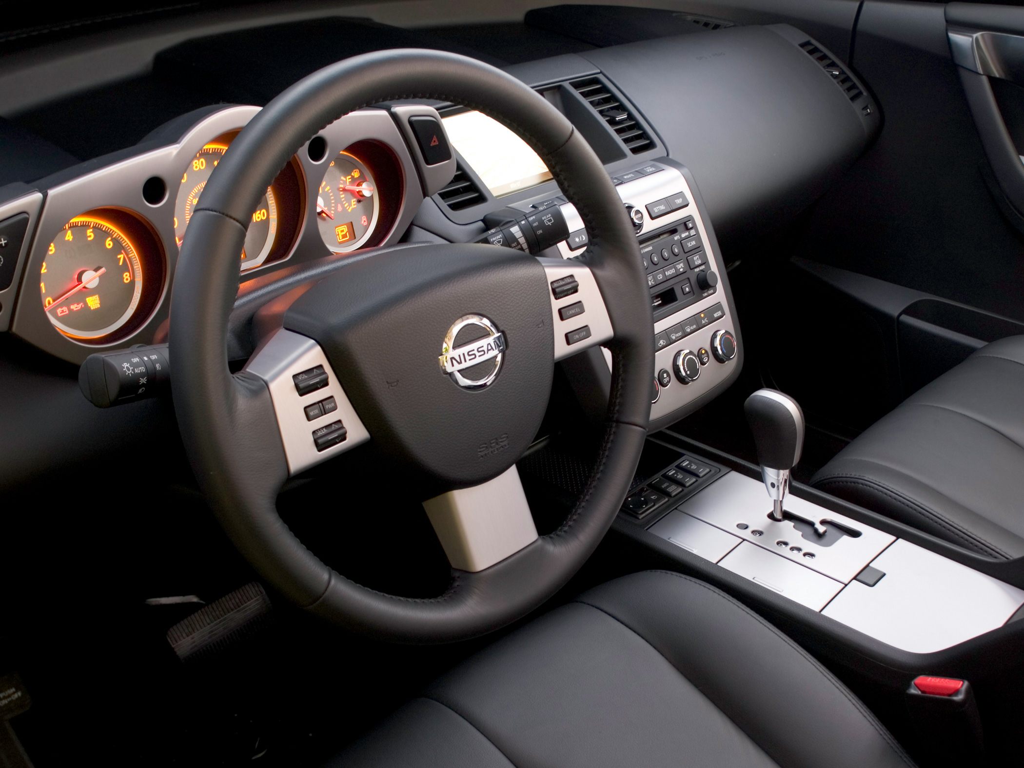 Steering wheel with controls and center console gear shift interior