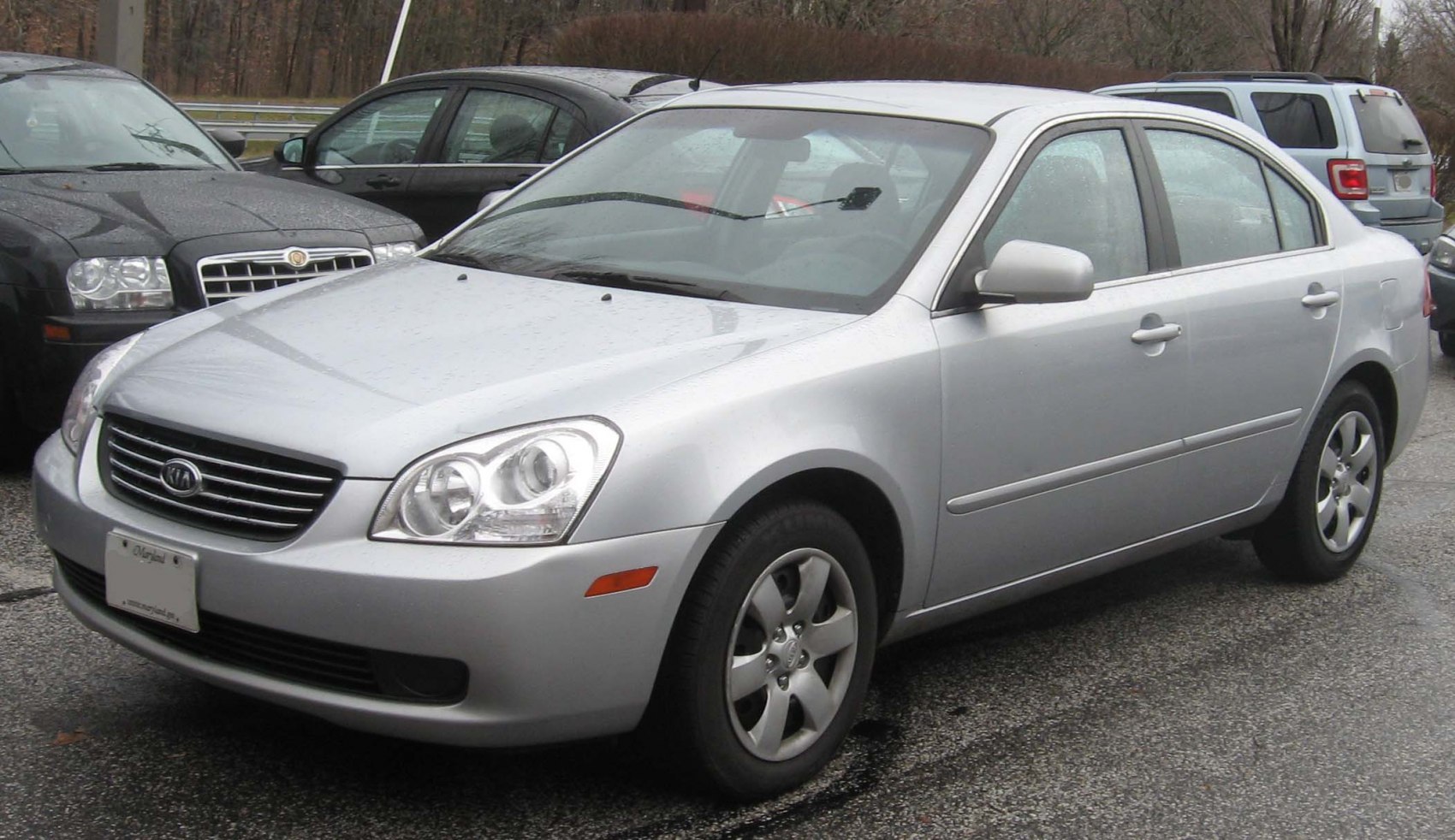 Silver mid-size sedan with prominent front grille and alloy wheels