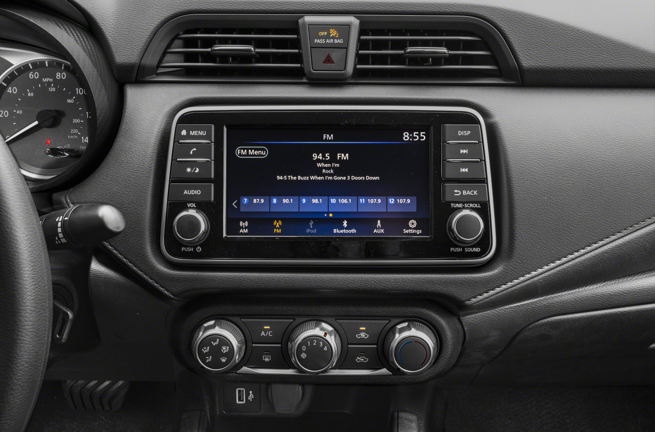 Touchscreen infotainment and manual climate control dials