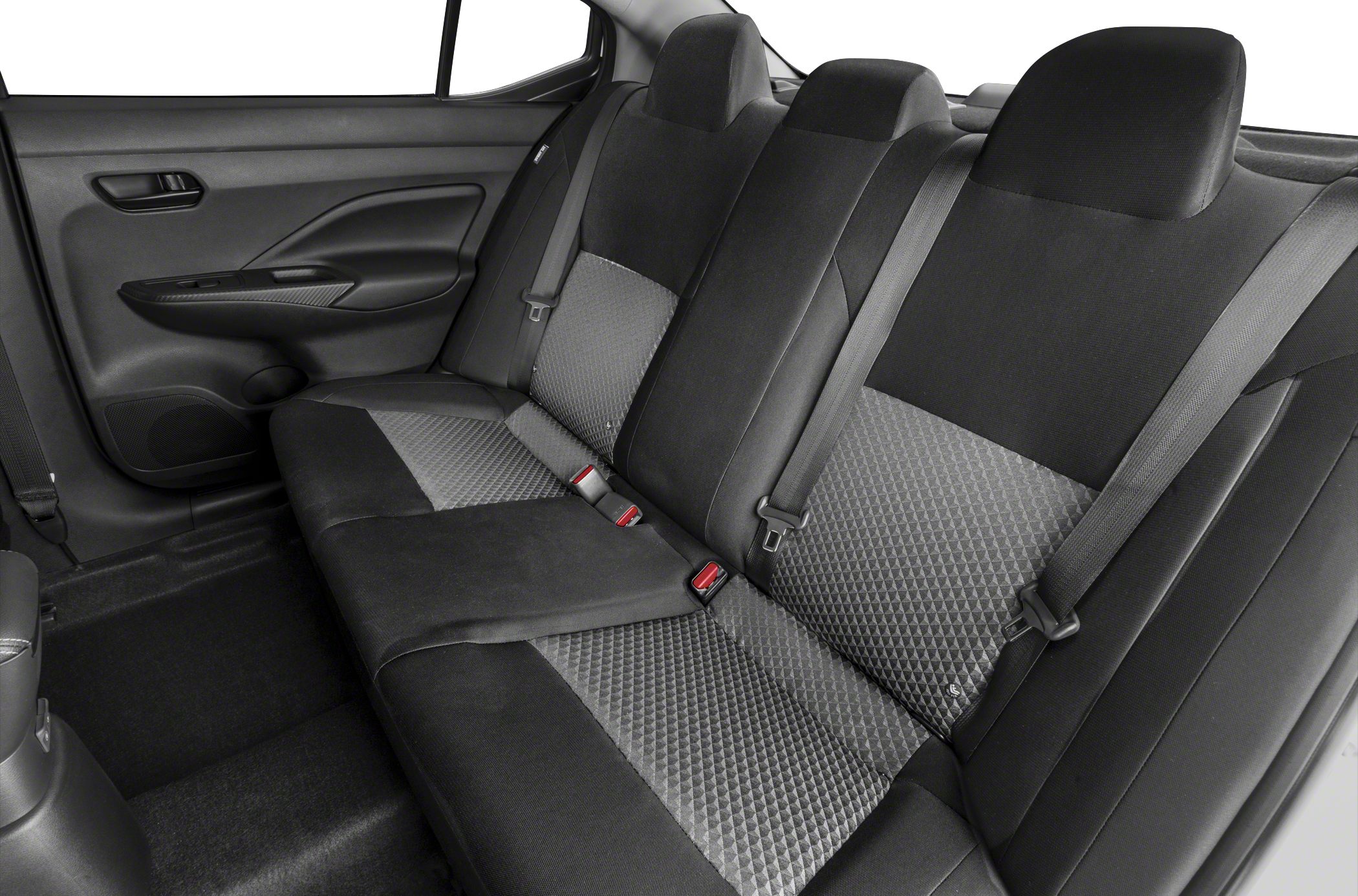 Rear seat with black patterned fabric upholstery and seat belts