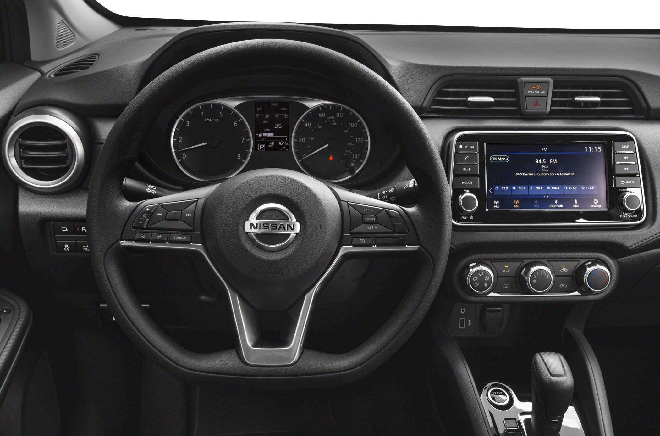 Steering wheel and infotainment dashboard with climate controls.
