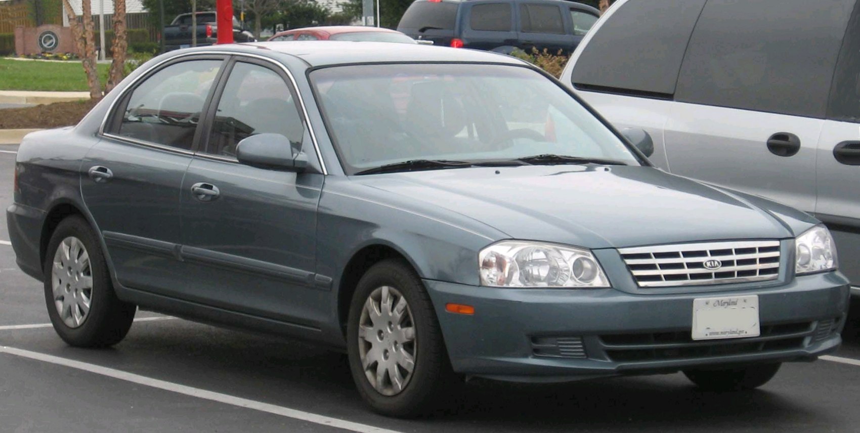 Front side view of a four-door sedan with classic early 2000s design
